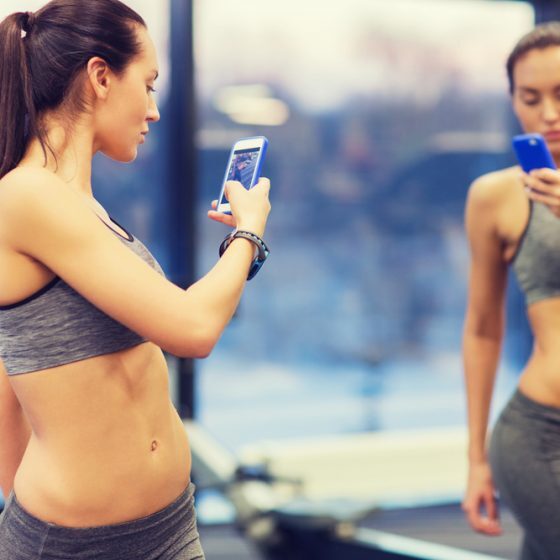 woman taking progress photo