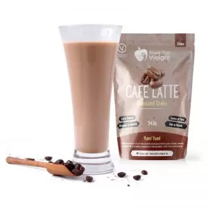 café latte diet protein shake in glass with sachet