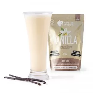 vanilla diet protein shake in glass with sachet