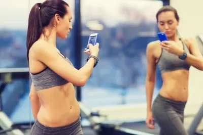 woman taking progress photo