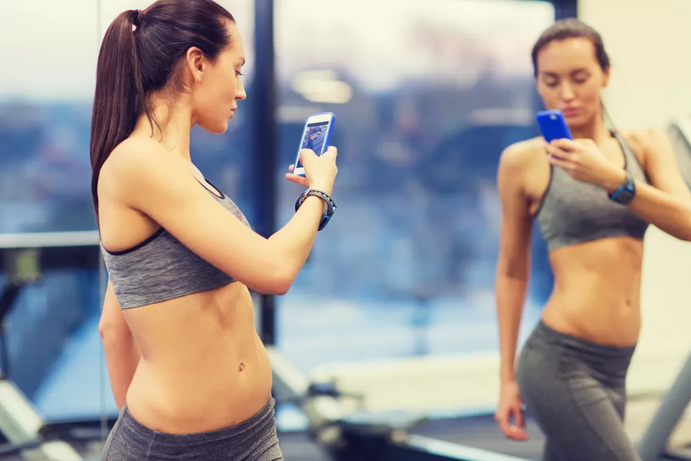 woman taking progress photo