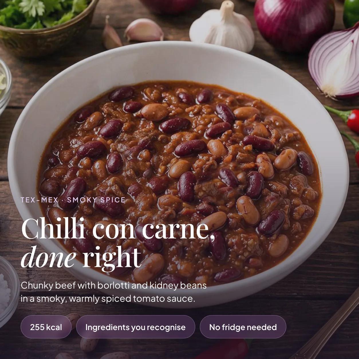 Bowl of EatProtein chilli con carne ready meal with beef, borlotti and kidney beans in a smoky spiced tomato sauce — 255 kcal, no fridge needed