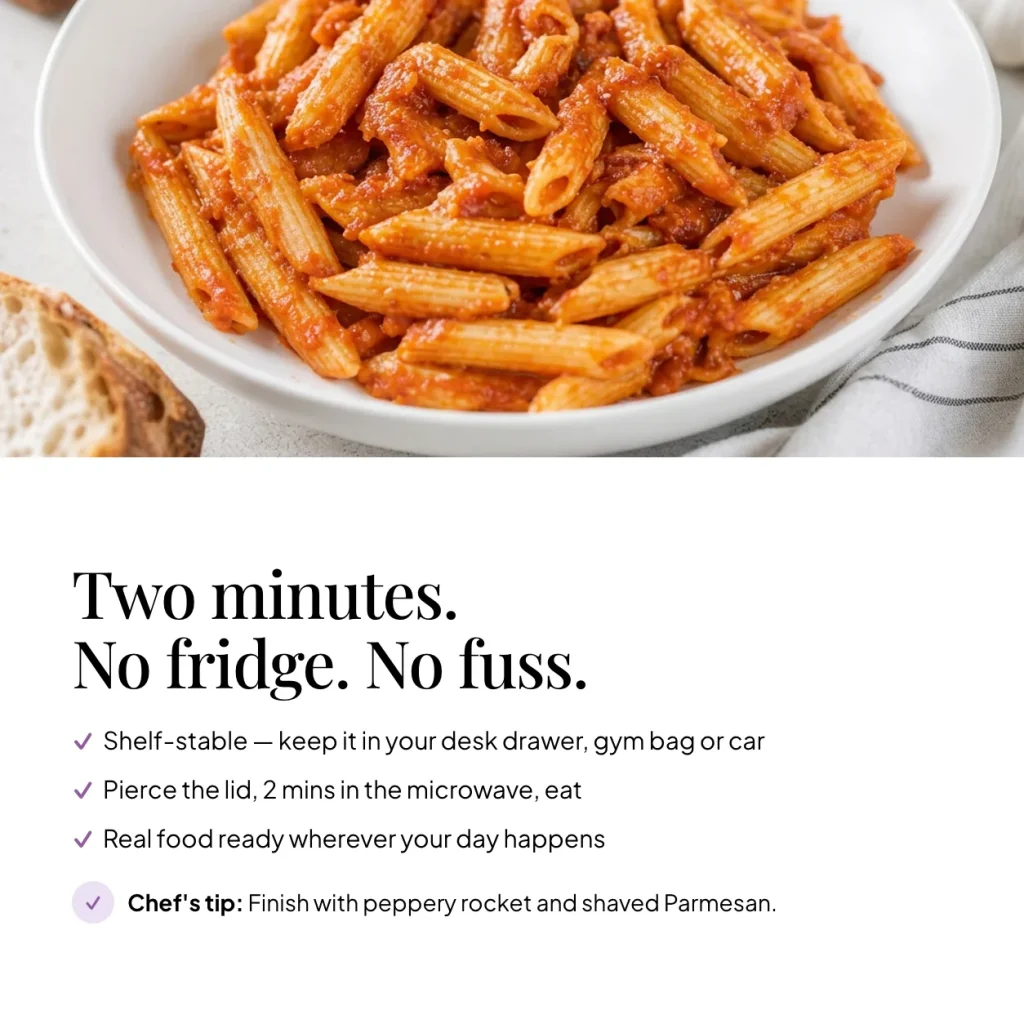 Bowl of EatProtein penne arrabbiata ready meal — shelf stable, pierce the lid and microwave for 2 minutes; chef's tip: finish with peppery rocket and shaved Parmesan