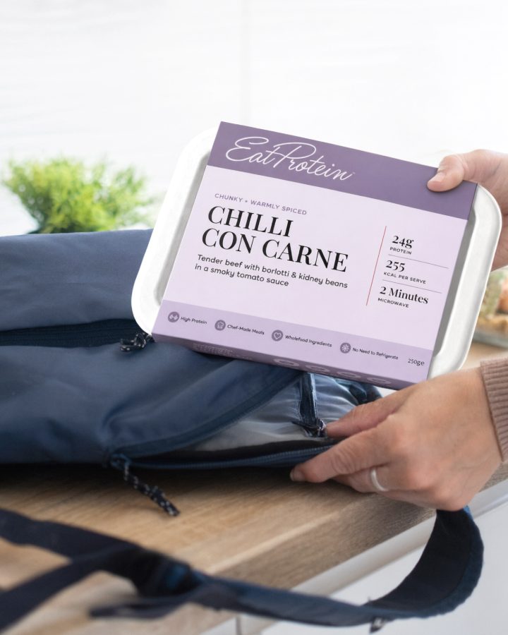 A ready meal being packed into a gym bag